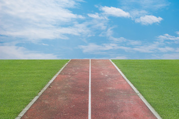 Running track over blue sky and clouds