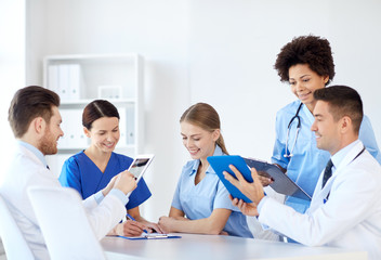 group of happy doctors meeting at hospital office