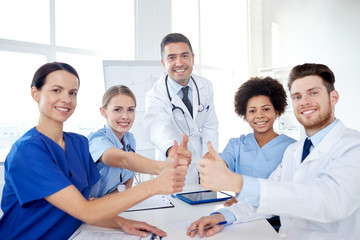 Fototapeta premium group of doctors showing thumbs up at hospital