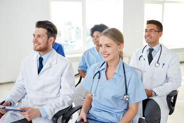 group of happy doctors on seminar at hospital