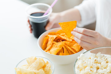 close up of woman with junk food and cola cup