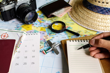 diary and calendar with passport and map