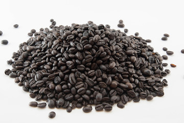 Roasted coffee beans, white background isolated