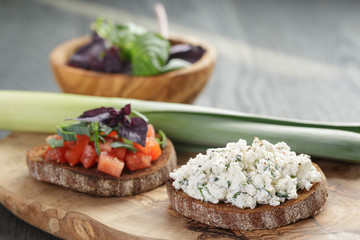 homemade bruschetta with tomatoes, basil and leek