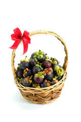 mangosteen thai fruit in basket isolated on white background