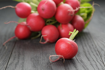 freshly harvested radishes on rustic table