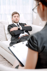 Young man with his psychologist