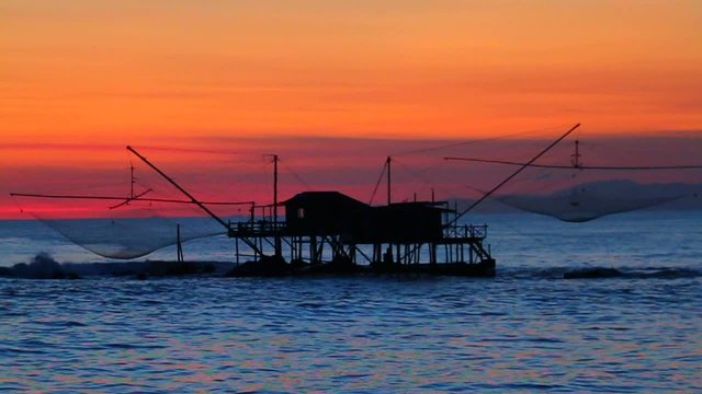 ancient fishpond sea at sunset