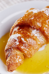 Croissant with honey
