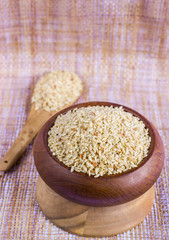 brown rice in a wooden bowl