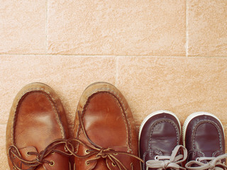 Father and son concept with boat boots style shoes, instagram toned effect