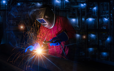 worker work hard with welding process in production plant
