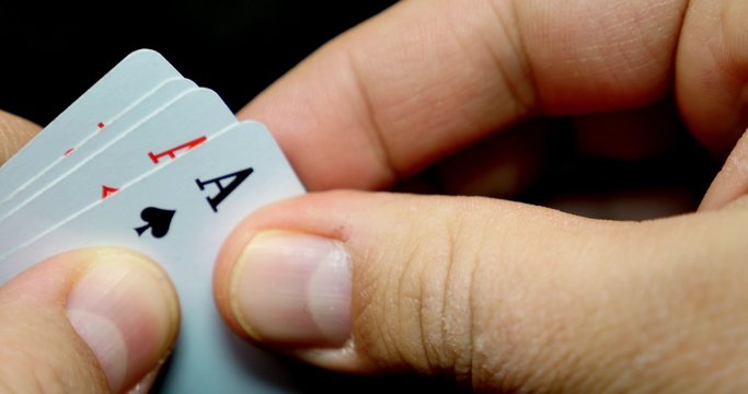 A person reveals his cards, he has got four aces...