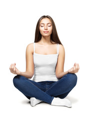 Happy young woman sitting in lotus position