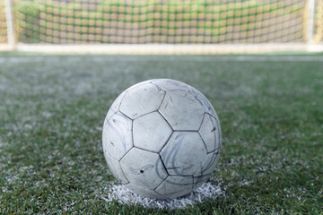 Soccer ball on  green field