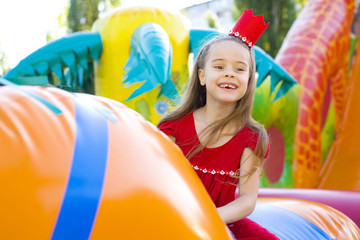 A child plays on the bright trampoline
