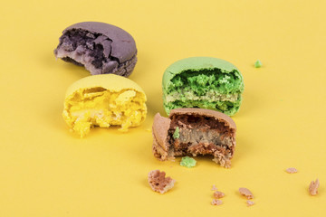bitten macaroons on yellow