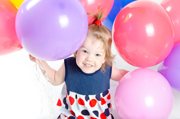 Fototapeta na wymiar Baby girl and ballons