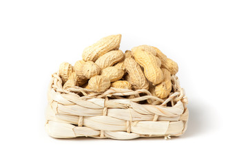 peanuts isolated in basket on white background