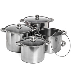 Set of 4 stainless pots with glass lids isolated on white