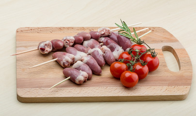 Raw chicken hearts for barbecue