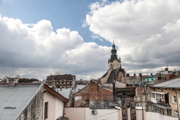 High tower among old roofs, Lviv