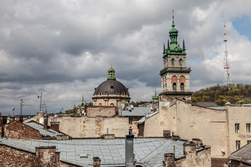 High tower among old roofs, Lviv