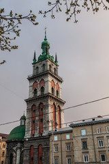 Obraz premium Church tower over ancient city landscape