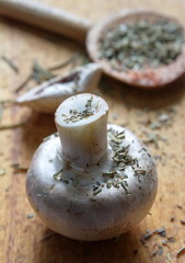 mushrooms - champignons with spoon and spice