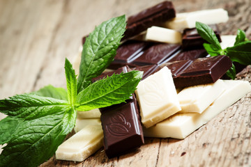Delicious white and dark chocolate with mint, selective focus