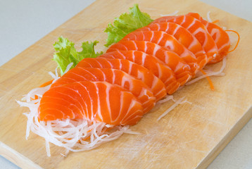 fresh sashimi saimon on wood background
