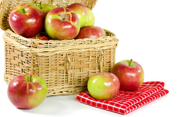 apples in wicker picnic basket