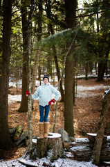 Naklejka na ściany i meble teen girl outdoors in a winter forest