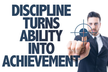 Business man point: Discipline Turns Ability Into Achievement