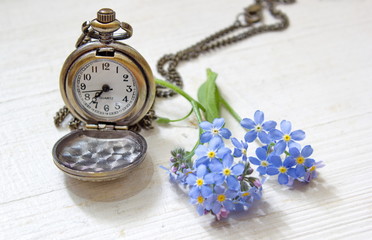 old pocket watch with forget me nots
