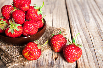 fruit. Fresh strawberries on old wooden background
