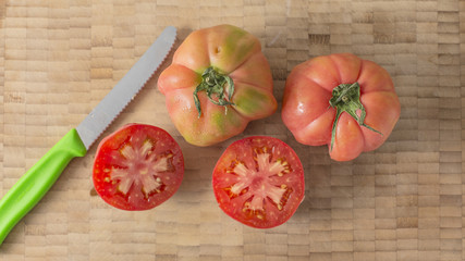 Fresh red tomatoes cut close up