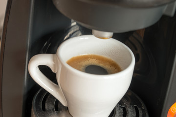 cup of espresso / a cup of espresso is brewed