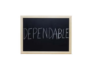 Fototapeta premium DEPENDABLE written with white chalk on blackboard.