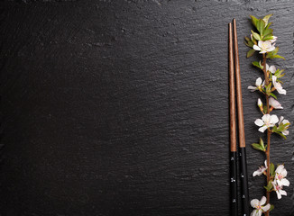 Japanese sushi chopsticks and sakura blossom