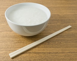Soft Boiled Rice or Rice Porridge with Chopsticks