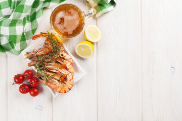 Beer mug and grilled shrimps