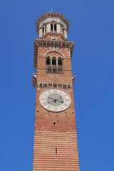 Fototapeta na wymiar Tower with hours, Lamberti tower on Erbe Square. Verona, Italy