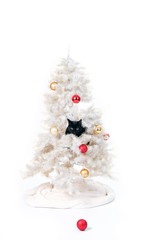 black cat in a christmas tree