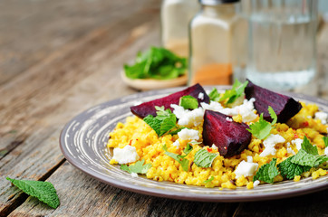 spiced millet porridge with beetroot, coriander, mint and feta