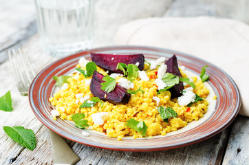 spiced millet porridge with beetroot, coriander, mint and feta