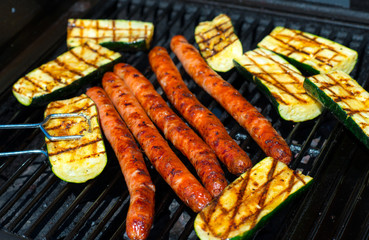 barbecue with sausage and grilled zucchini