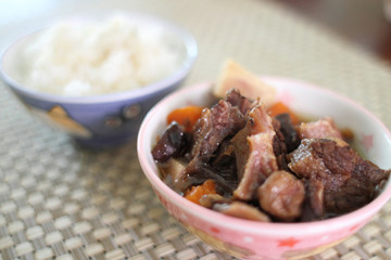 Bowl of white rice with Korean beef stew known as 