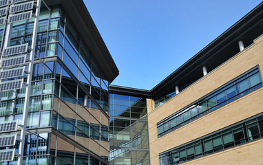Fototapeta premium Contemporary Glass Office Building on Business Park