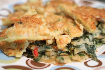 Sliced Korean scallion pancakes known as 